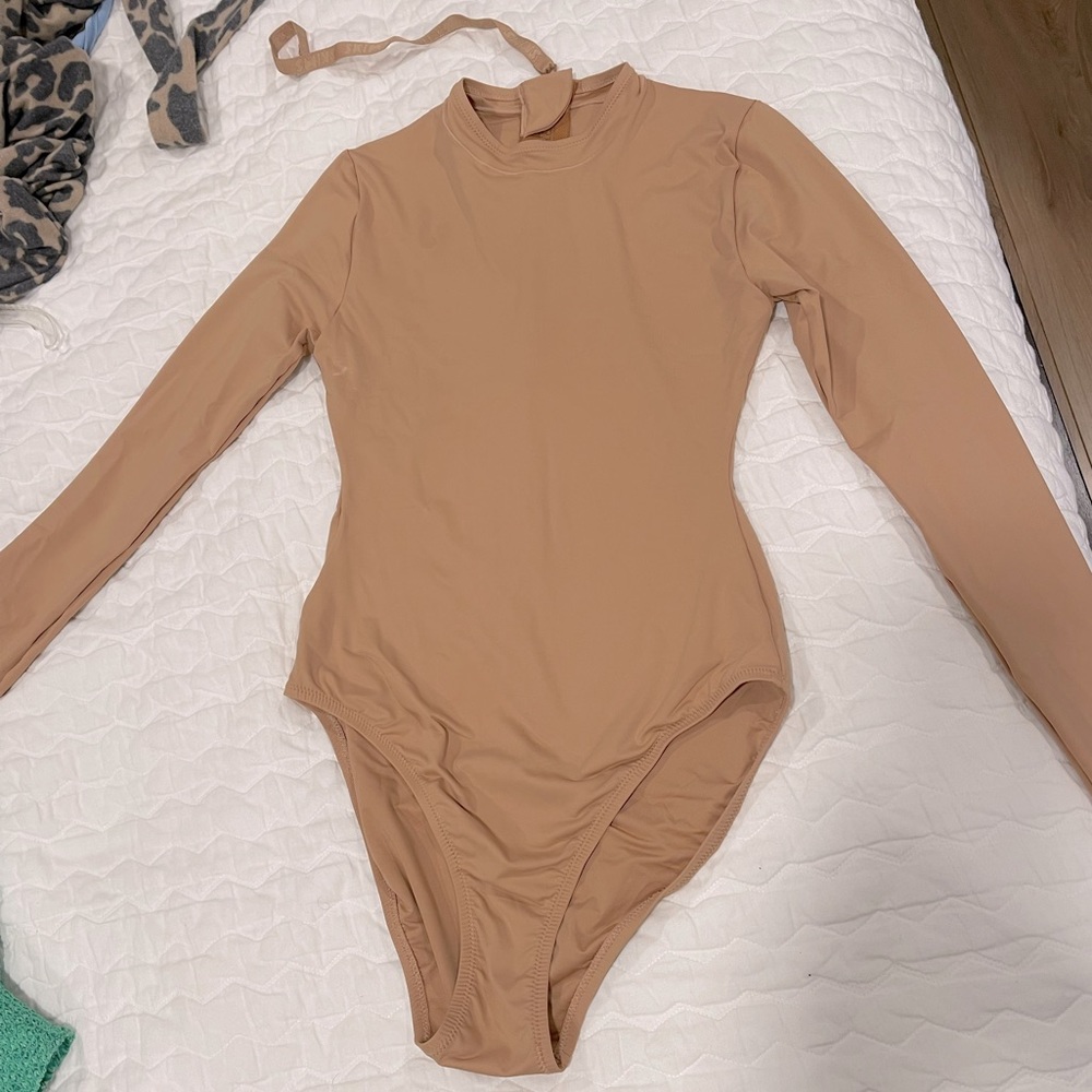 Skims one piece. Size small. Never been worn but does not have tags